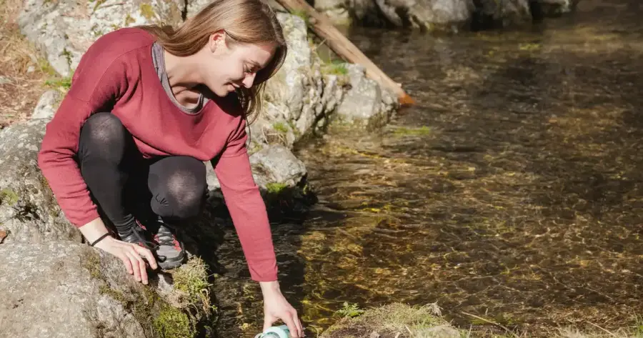 Portable water filter and purification tablets side by side for emergency comparison