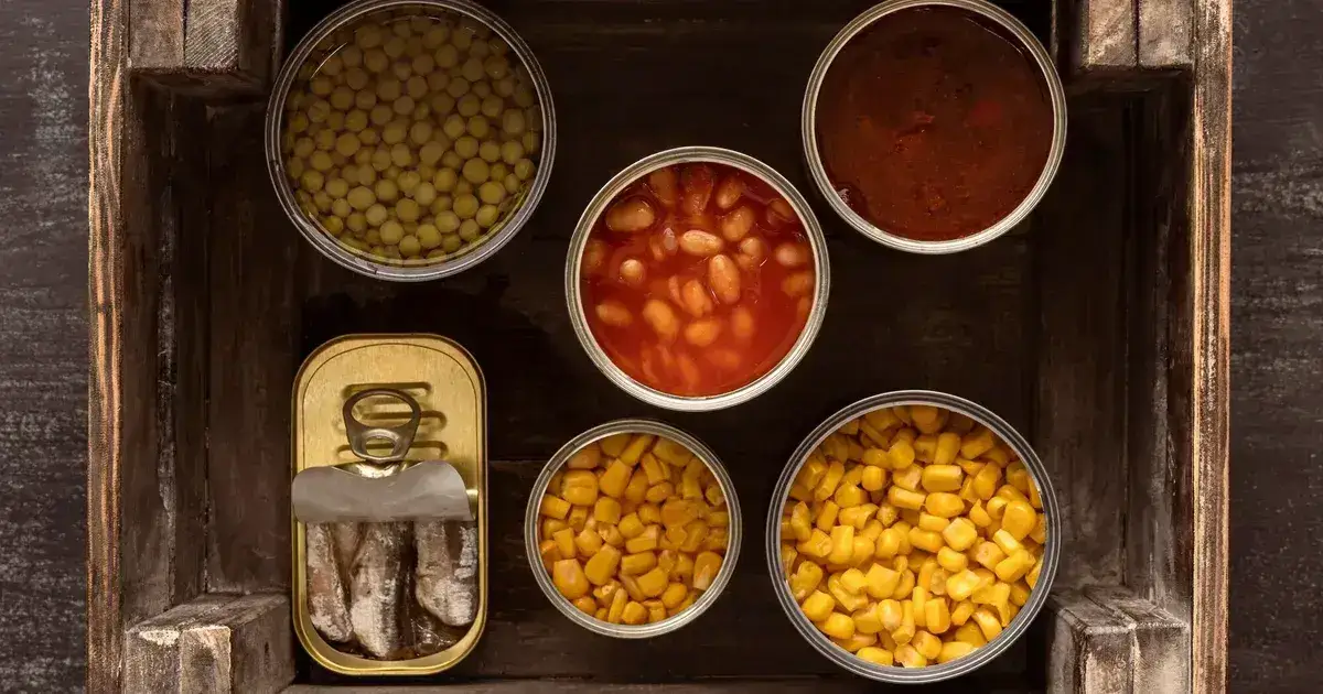 Freeze-dried meal pouches next to canned food for emergency reserve