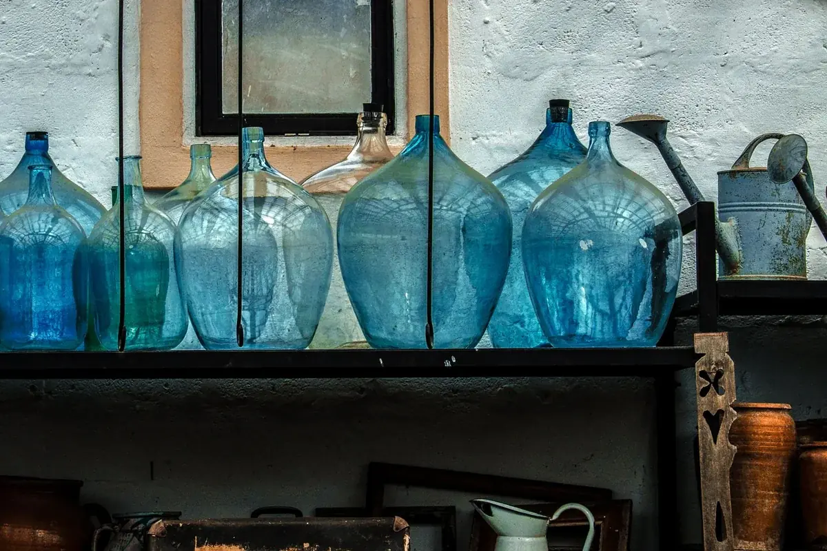 Organized pantry with water bottles and jugs stored